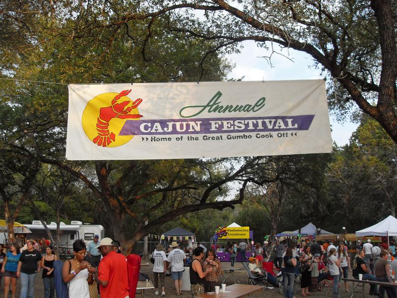 Cajun Festival banner hanging above the festival grounds